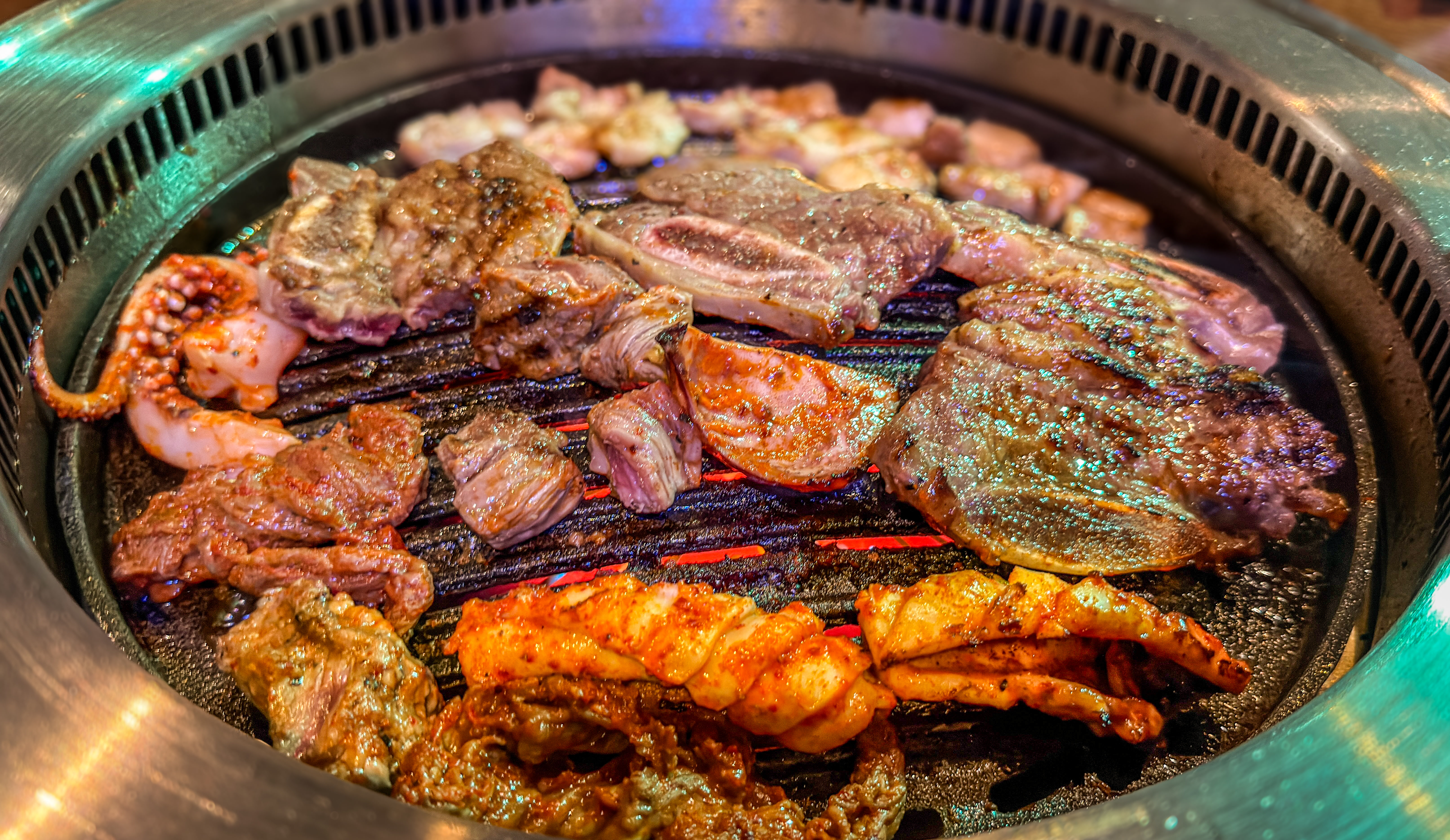 Mixed meats and seafood on the grill